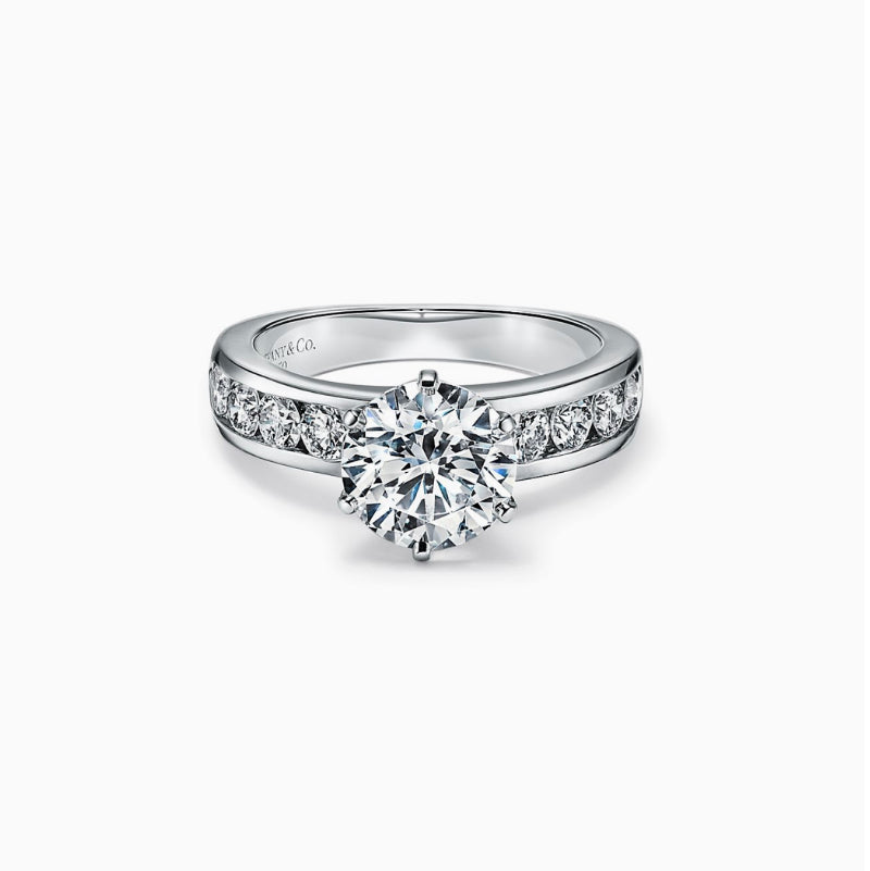 Tiffany Style Setting Engagement Ring with a Channel-set Diamond Band in 18K Yellow and White Gold